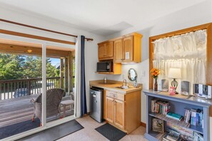 A compact kitchen with a microwave, sink, and wooden cabinets. - Only a 2 minute walk to the Avon beach! Private Pool, Hot Tub, Luggage Lift (Avon)