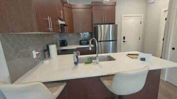 Coffee/tea maker, fridge, microwave, oven