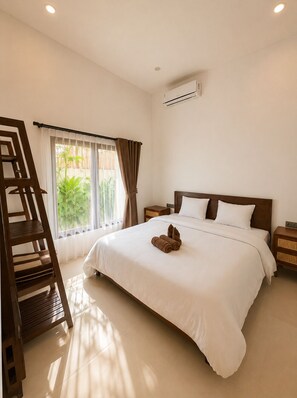 A hotel room with a bed, a wooden ladder, a nightstand, and an air conditioning unit.
