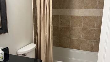 Shower, towels, soap, toilet paper