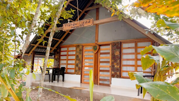A traditional wooden building with a sign reading 'tranquilidad.' - Tranquilidad Cabin, Left Hemisphere (San José Del Guaviare)