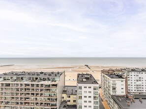 A high-rise hotel with multiple balconies overlooking a beach. - O'Sea with seaview & terrace by Interhome (Oostende)