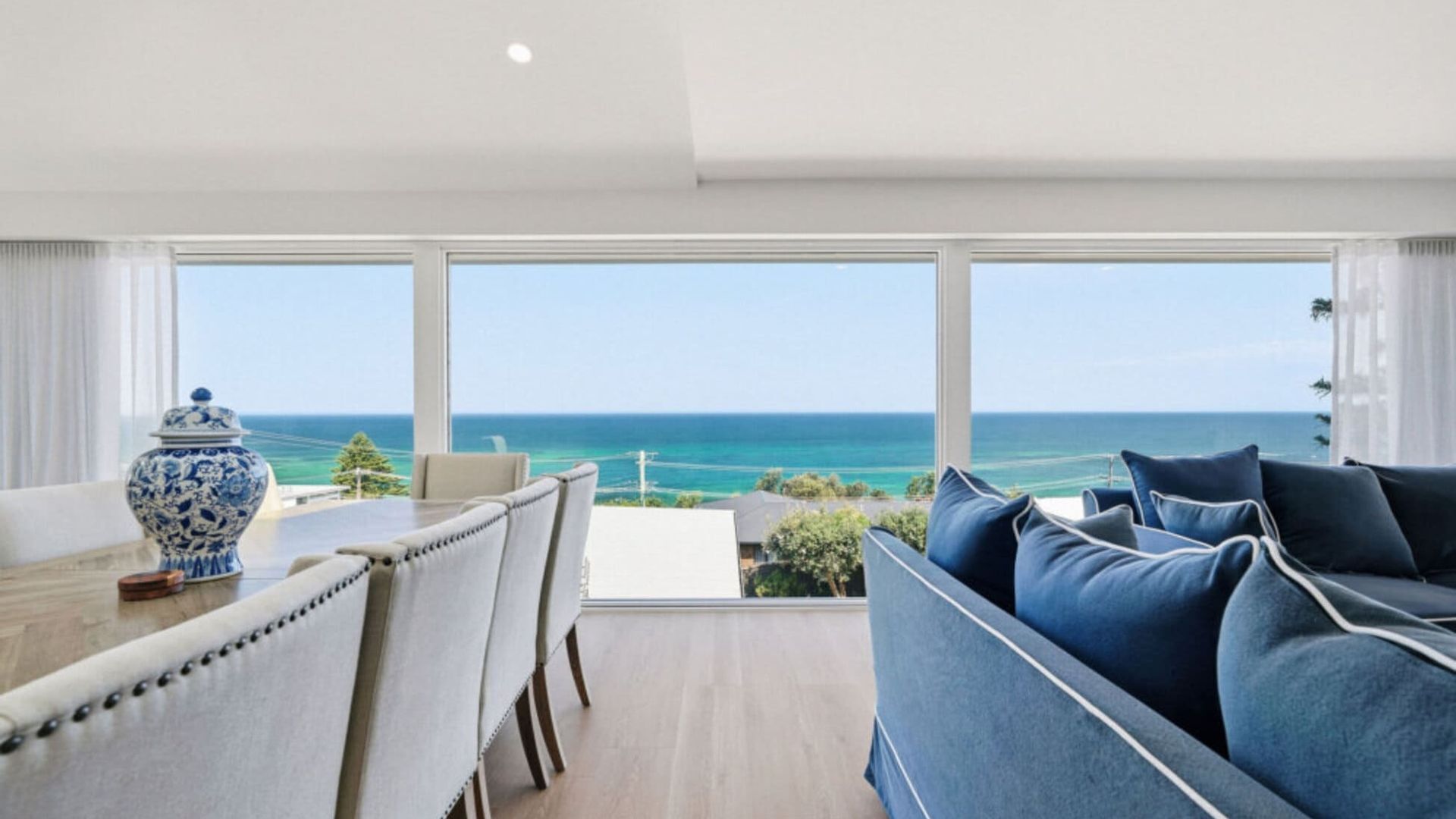 Open-plan living and dining with stunning ocean views.