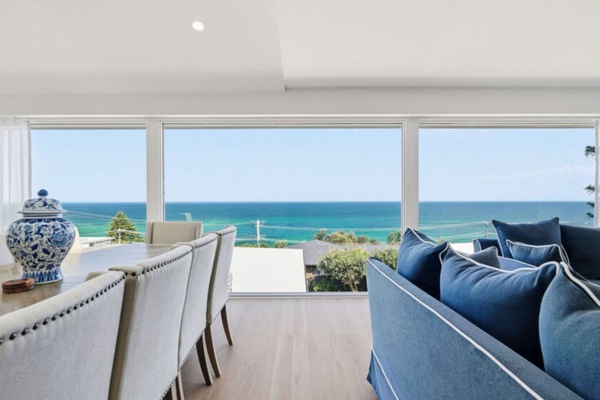 Open-plan living and dining with stunning ocean views.