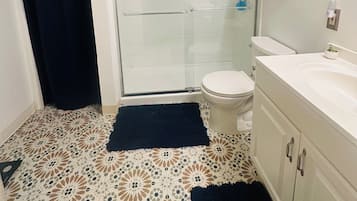 Shower, hair dryer, towels, soap
