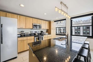 Coffee/tea maker, fridge, microwave, oven - Sunlit 2BR Loft with In-Unit Laundry | Downtown Detroit (Detroit)
