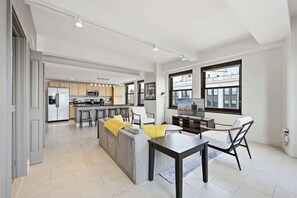 TV, offices - Sunlit 2BR Loft with In-Unit Laundry | Downtown Detroit (Detroit)