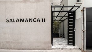 A building entrance with a sign reading 'SALAMANCA 11' and a metal gate. - Myla - 01C Roma Norte - LowF (Mexico City)
