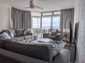 Standard House | Living area | 55-inch TV with cable channels - Uvongo Holiday's (Margate)