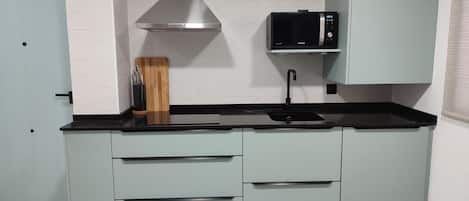 Fridge, microwave, stovetop, coffee/tea maker