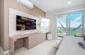 A modern bedroom with a large bed, a TV mounted on the wall, and a balcony with a view. - Corporate Stays Aqua (Altos)