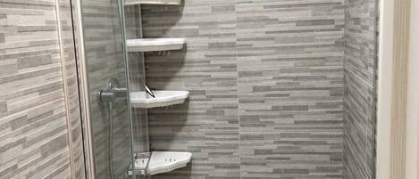 Shower, hair dryer, towels, toilet paper