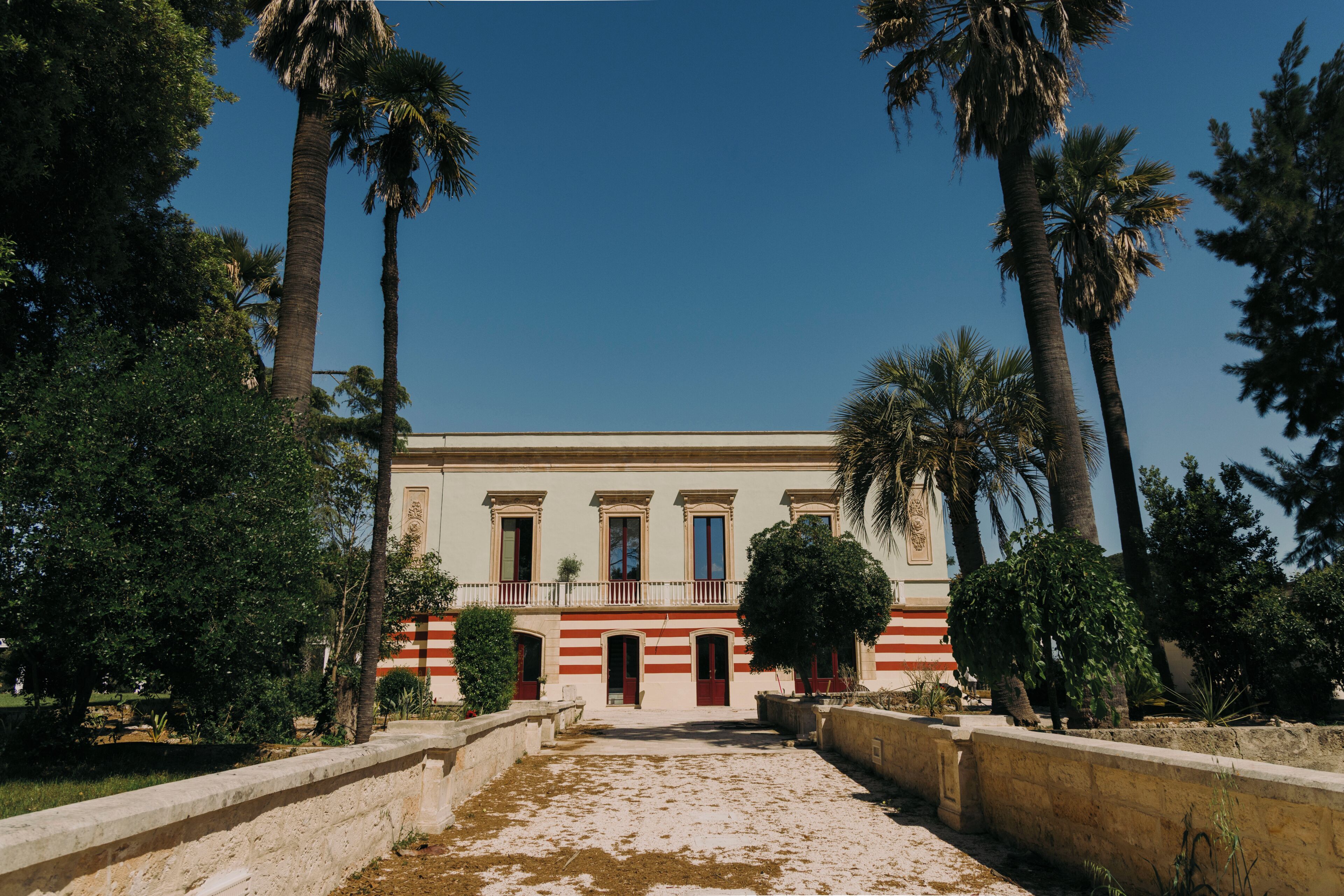 A building with a symmetrical facade, large windows, and a central entrance.