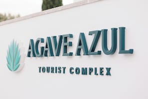 A sign for the Agave Azul Tourist Complex. - 6. Riviera Esmeralda: Relaxation and beauty in one place (Torrent)