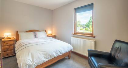 Large detached property centrally located in the Scottish Highlands.