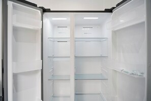 An empty refrigerator with multiple shelves and a 'Multi Airflow' label. - Spacious 4BR Darlington Sleeps 8 by Stay with us (Darlington)
