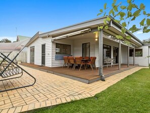A single-story building with a covered patio area, a brick pathway, and a grassy lawn. - Rye Coastal Oasis - PAY 2, STAY 3 Nights! (Blairgowrie)