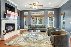 TV, fireplace - Family-Friendly Beach Home with Playground & BBQ Patio near Panama City Beach Shoreline & Pier Park, Panama City Beach, Florida (Panama City Beach)
