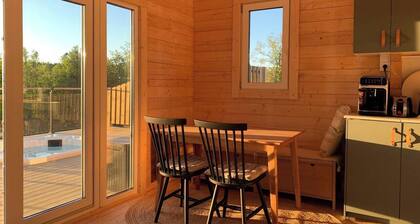 Log cabin with hot tub and views