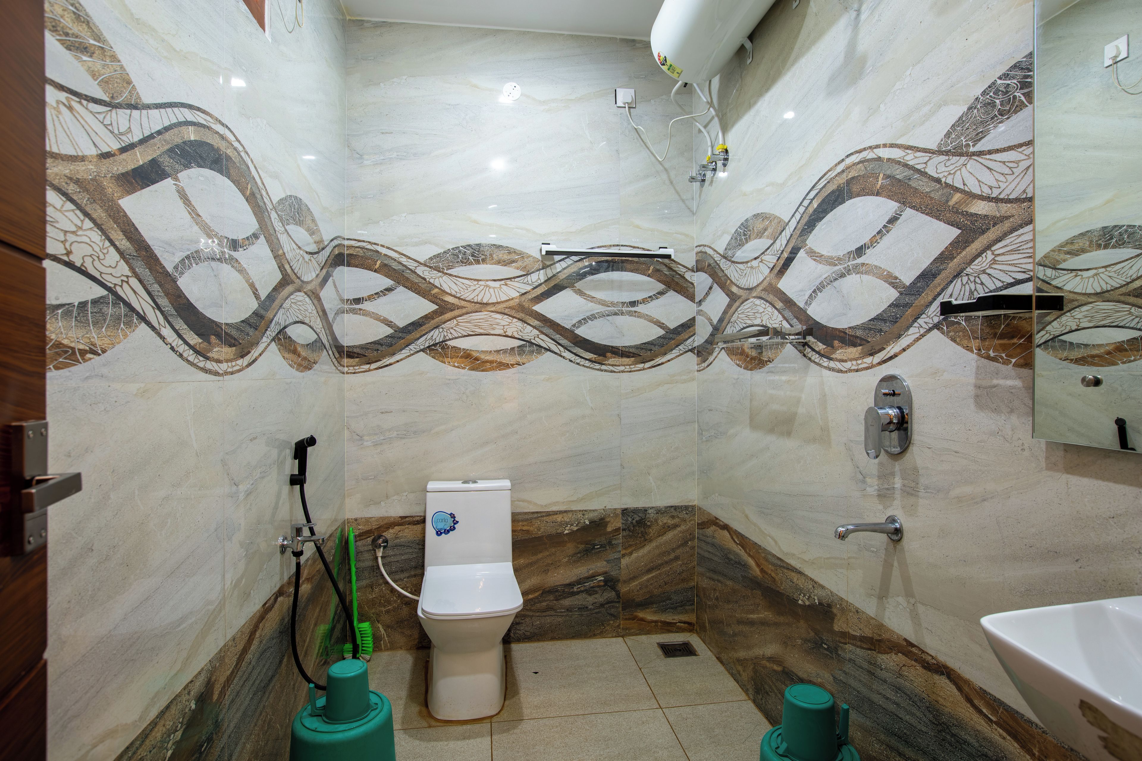 A bathroom with a toilet, shower, and sink.