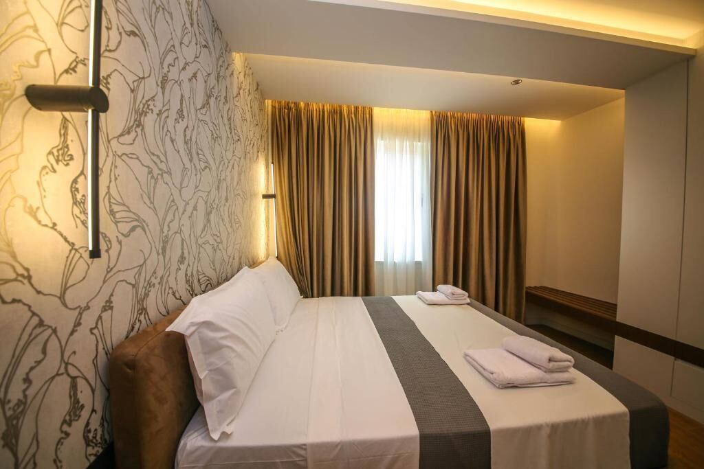 Suite, balcón, vistas a la ciudad | Escritorio y wifi gratis