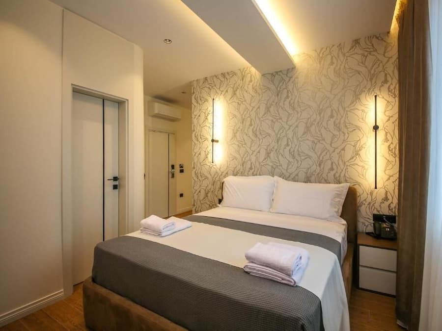 Suite, balcón, vistas a la ciudad | Escritorio y wifi gratis