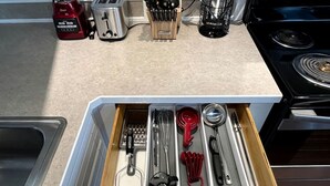 A kitchen drawer with utensils, a toaster, and a blender. - Amazing Vacation Rental in Sabine National Forest on Toledo Bend Lake for a Fantastic Family Escape in Hemphill, Texas (Hemphill)