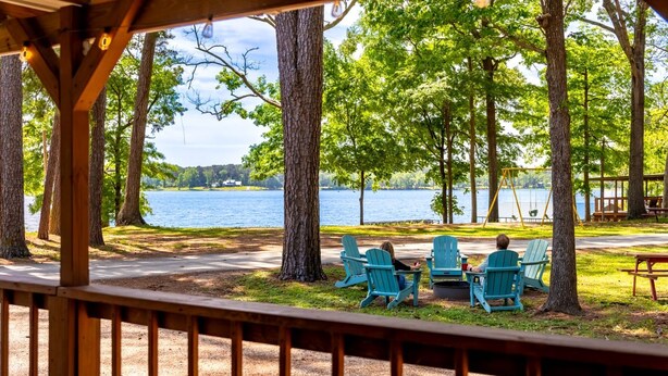 A lakeside view with a gazebo, chairs, and a swing set. - Amazing Vacation Rental in Sabine National Forest on Toledo Bend Lake for a Fantastic Family Escape in Hemphill, Texas (Hemphill)
