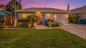 A single-story house with a front door, number 759, a garage, and a well-maintained lawn. - Private Tropical Oasis • Heated/Cooled Pool (Naples)