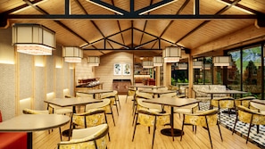 A restaurant with wooden interior, tables, chairs, hanging lights, and a view through large windows. - Himalayan Woodcroft, Sirmaur - IHCL SeleQtions (Pachhad)