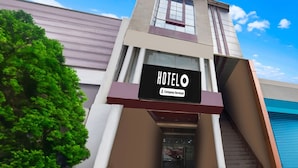 A hotel building with a sign reading 'HOTEL O' and 'Company-Serviced.' - Classic Hotel Shantila Inn (Prayagraj)