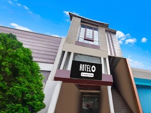 A hotel building with a sign reading 'HOTEL O' and 'Company-Serviced.' - Classic Hotel Shantila Inn (Prayagraj)