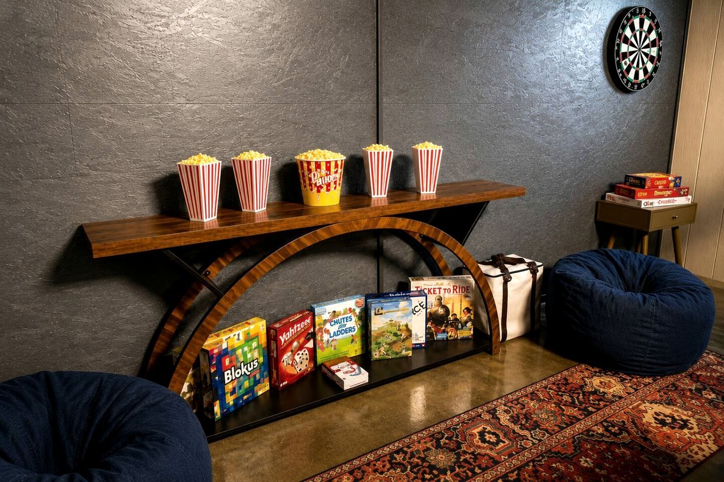 A room with a wooden shelf holding popcorn, a dartboard, and a small table with board games and a ticket to ride game.