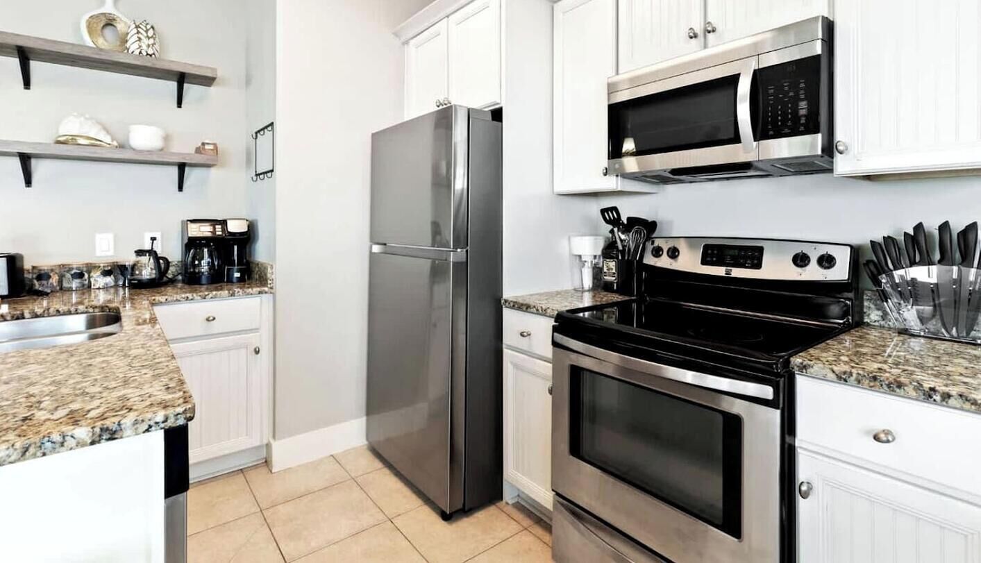 Coffee/tea maker, fridge, microwave, oven
