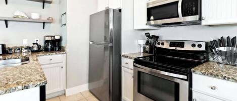 Coffee/tea maker, fridge, microwave, oven