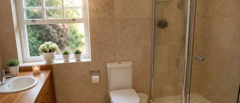Shower, hair dryer, towels, toilet paper