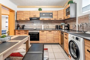 Coffee/tea maker, fridge, microwave, oven