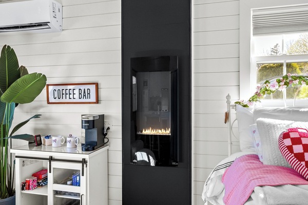 Decorative fireplace adds extra charm to the cozy interior