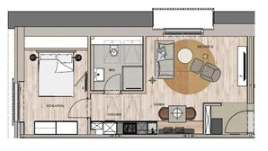 Pianta del pavimento di una camera d'albergo con un letto, un bagno, angolo cottura, zona soggiorno con TV e una piccola sala da pranzo.