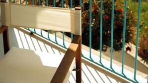A balcony with a view of the sea and a chair. - Casa Totò - Ocean View in the Center of Otranto Terrarossa Luxury Home (Otranto)