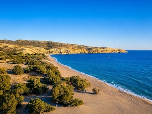 A coastal landscape with a beach, cliffs, and sparse vegetation. - Villa Maria Christina With Private Pool in Crete (Faistos)