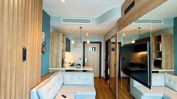 Suite, Sea View | Living area | 55-inch LCD TV with satellite channels