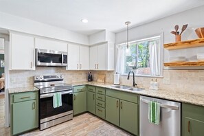 Coffee/tea maker, fridge, microwave, oven