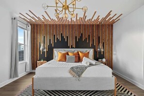 Experience luxury in this stylish master suite! ✨ Featuring a plush king bed, chic wood-accented design, elegant lighting, and warm tones for ultimate comfort. Perfect for relaxation and a restful stay. Book now for a dream getaway! - Themed Villa w/ Pool, Spa, Walk to Water Park (Kissimmee)