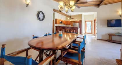 Welcome in the island breeze or head outside to sit on the large deck,