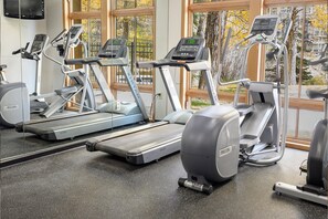 A gym with treadmills, ellipticals, and a stationary bike. - Zephyr Mountain Lodge Unit 1407 Private deck ski-in/ski-out on site amenities (Winter Park)
