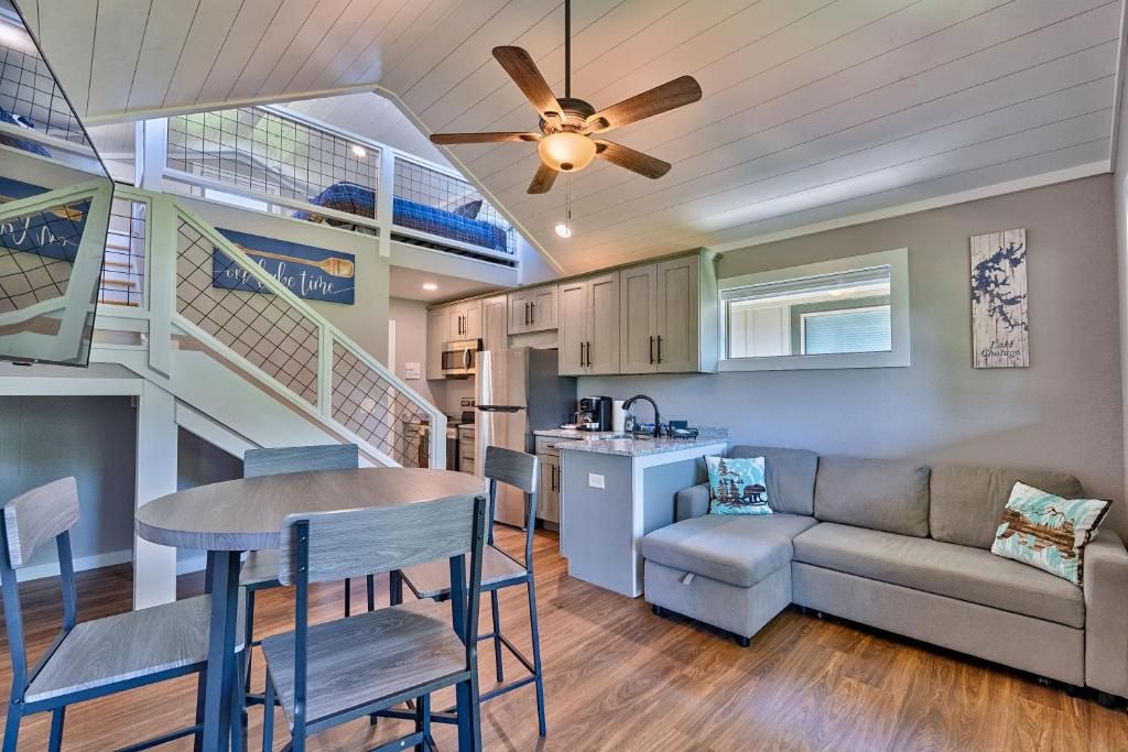 A multi-level living space with a dining area, kitchen, and seating area.