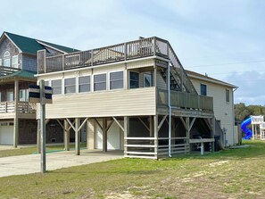 A two-story building with a balcony and a slide.