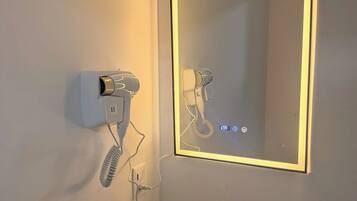 Shower, hair dryer, towels, toilet paper