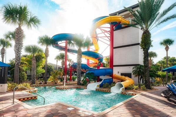 A water park with multiple slides and a pool area. - Amazing Home Near Parks w/ Pool & Spa (Kissimmee)